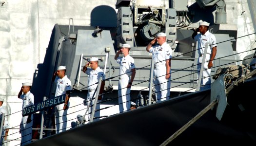 US Navy 080221-N-0879R-003 Sailors render honors aboard the Pearl Harbor-based guided-missile destroyer USS Russell (DDG 59) for the arrival of the Secretary of Defense (SECDEF) Robert M. Gates