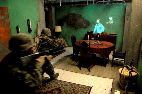 US Navy 080219-N-7676W-005 Marines from 3rd Battalion, 1st Marines, confront avatars, or virtual humans, while clearing a room at the Office of Naval Research Infantry Immersion Trainer (IIT) located at the I Marine Expeditiona
