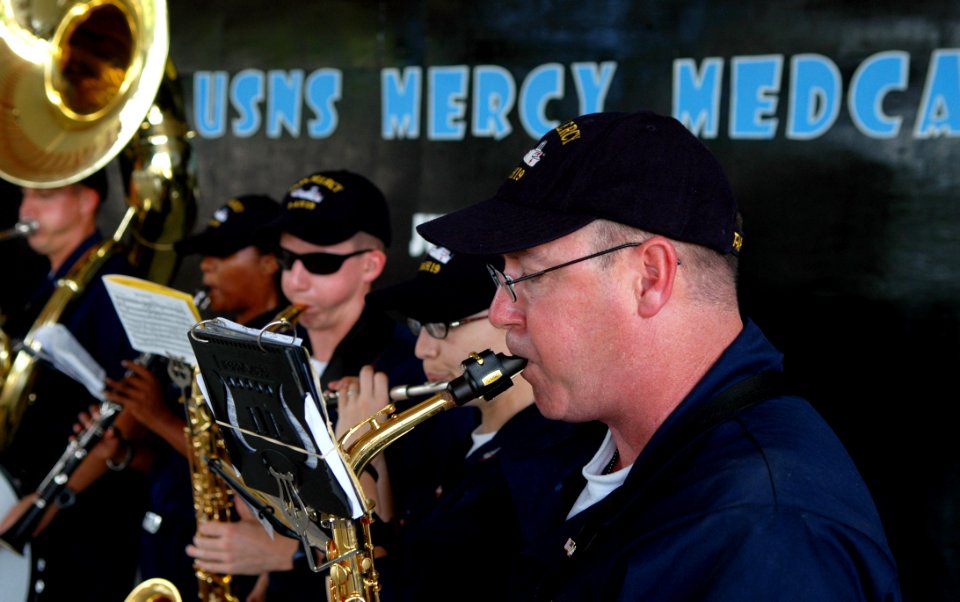 US Navy 080601-N-1328S-004 Sailors assigned to the Pacific Fleet Navy Band perform for families during a Pacific Partnership medical civic action program