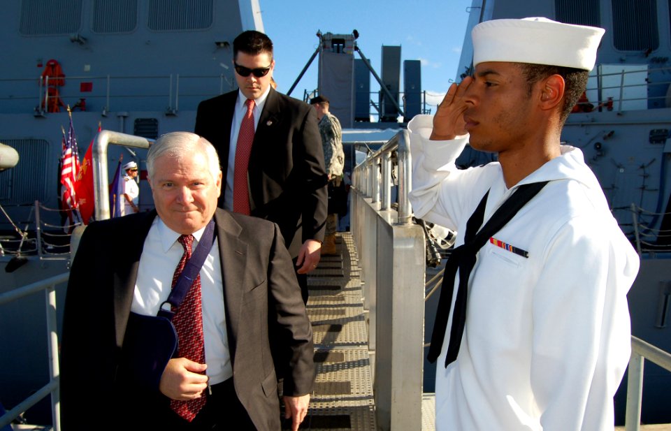 US Navy 080221-N-0879R-009 Following a brief tour of the Pearl Harbor-based guided-missile destroyer USS Russell (DDG 59), a Sailor salutes as the Secretary of Defense Robert M. Gates departs the ship