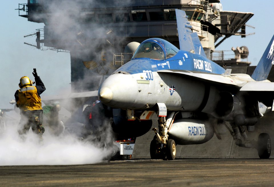 US Navy 080222-N-2984R-025 An F-A-18 Hornet assigned to Strike Fighter Squadron (VFA) 37 is taxied to a catapult prior to launching off the flight deck of the Nimitz-class aircraft carrier USS Harry S. Truman (CVN 75) during fl