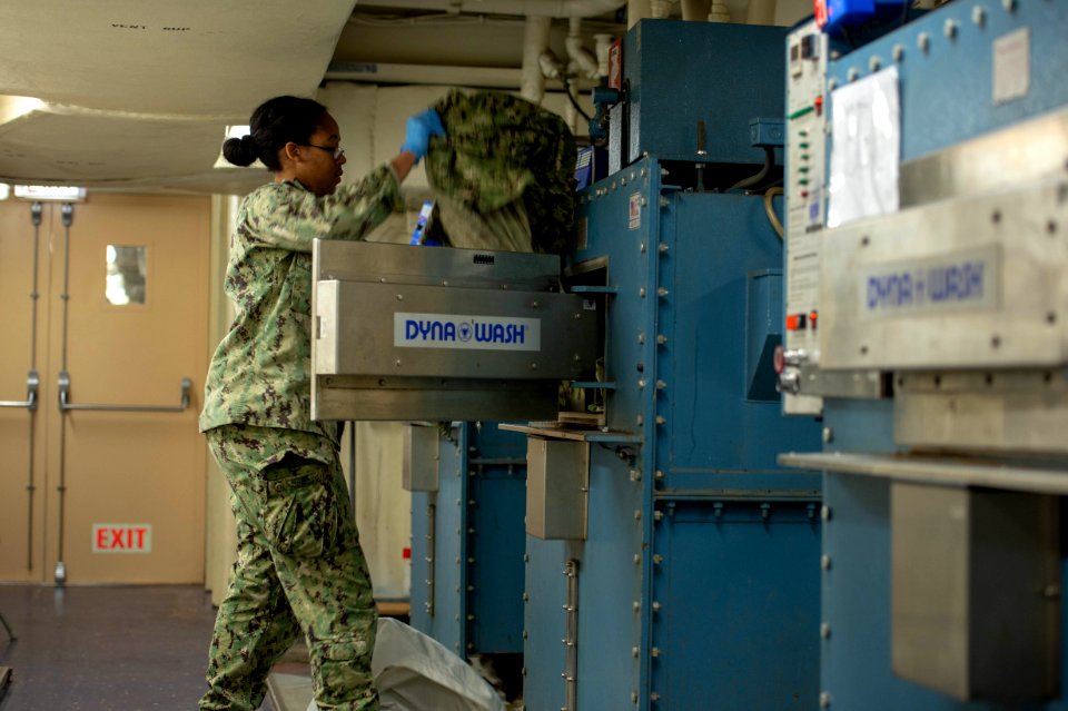 USNS Mercy Sailor Washes Uniforms (49753725173)
