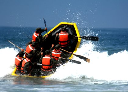 US Navy 080606-N-5366K-090 Basic Underwater Demolition-SEAL (BUD-S) students battle through the surf during their last day of Hell Week at Naval Special Warfare Center photo