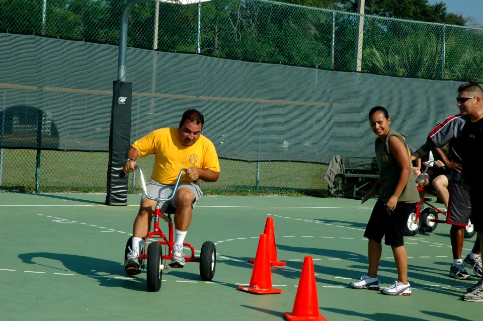 US Navy 080605-N-8102J-033 Senior Chief Electrician's Mate David Rini, assigned to Southeast Regional Calibration Center (SERCC), races to the finish line while being cheered on by shipmates
