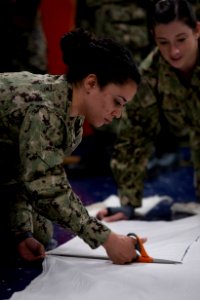 USNS Mercy Sailors Build Masks (49754592167)
