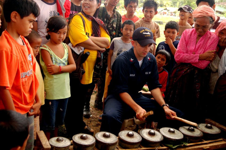 US Navy 080606-N-1328S-001 Musician 2nd Class Robert Taylor plays a traditional Philippine kulintang during a Pacific Partnership medical civic action program at Poblacion Elementary School