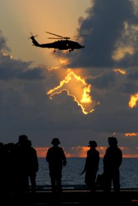 US Navy 080609-N-0640K-521 Sailors walk on the flight deck after a foreign object debris walk down