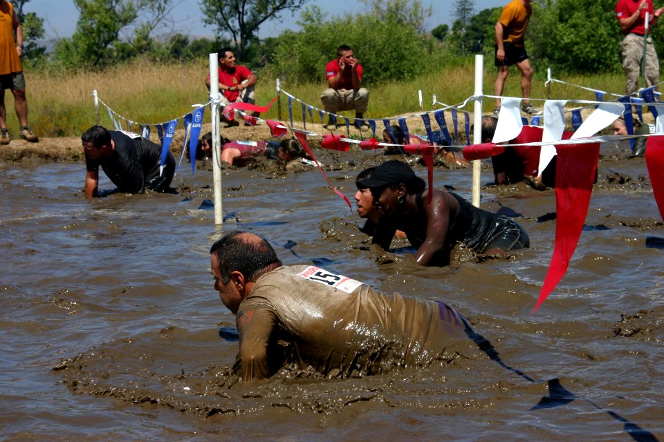 US Navy 080607-N-5191L-007 Participants of the 15 Annual Mud Run cross the final challenge after encountering several