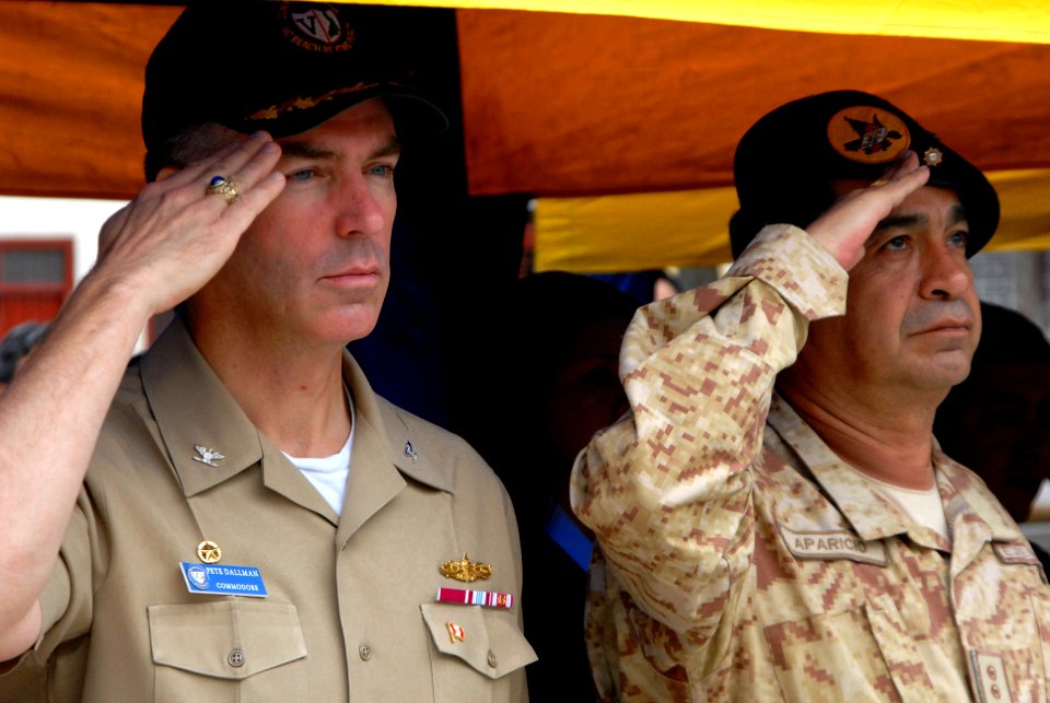 US Navy 080610-N-6410J-036 Capt. Peter Dallman, mission commander for Continuing Promise (CP) 2008 embarked aboard the amphibious assault ship USS Boxer (LHD 4), and a Peruvian military official render salutes for the U.S. nati
