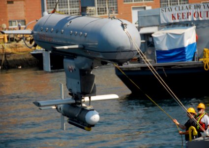 US Navy 080610-G-6464J-020 Members of Canadian Maritime Operations Group 4, Maritime Forces Pacific, based in Esquimalt, British Columbia, lower the Dorado, a 30-ft, 7-ton Interim Remote Mine Hunting and Detection System (IRMDS photo