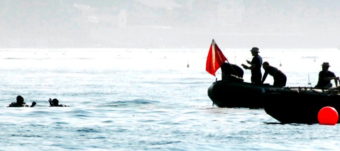 US Navy 080610-G-6464J-001 U.S Navy divers search for objects used to simulate mines during a multi-agency training exercise in the Piscataqua River during a Frontier Sentinel exercise photo