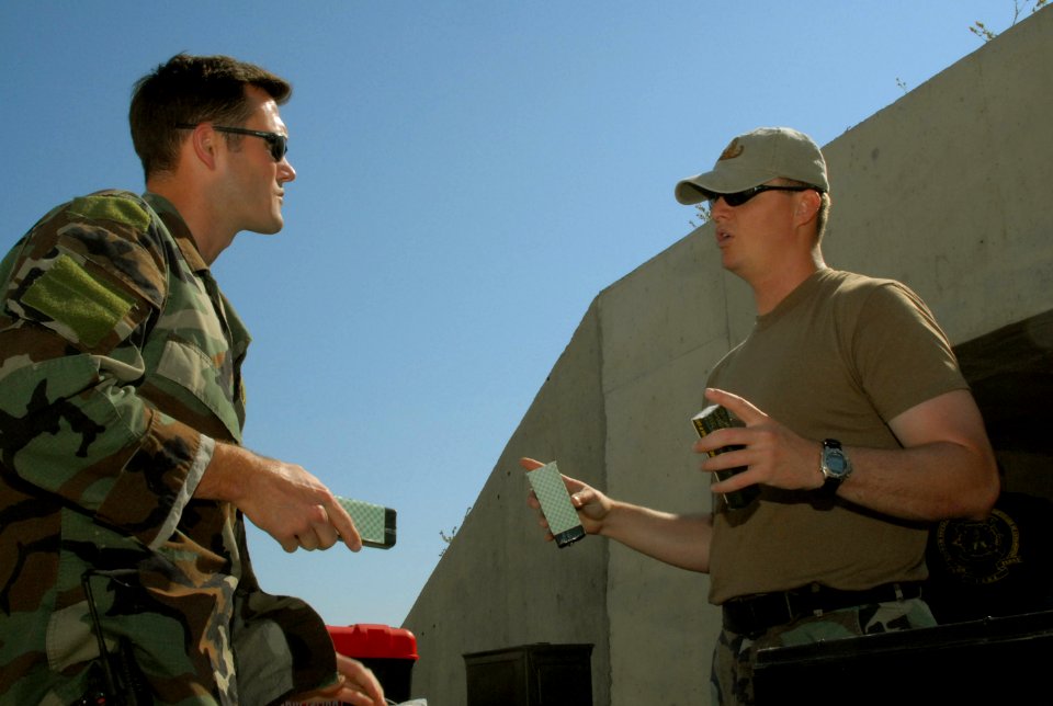 US Navy 080611-N-3289C-061 Lt. Matthew Coombs and Chief Explosive Ordnance Disposal Technician Kenneth Lee, assigned to Explosive Ordnance Disposal Mobile Unit (EODMU) 8 Det. Europe, discuss how to prepare C4 explosives