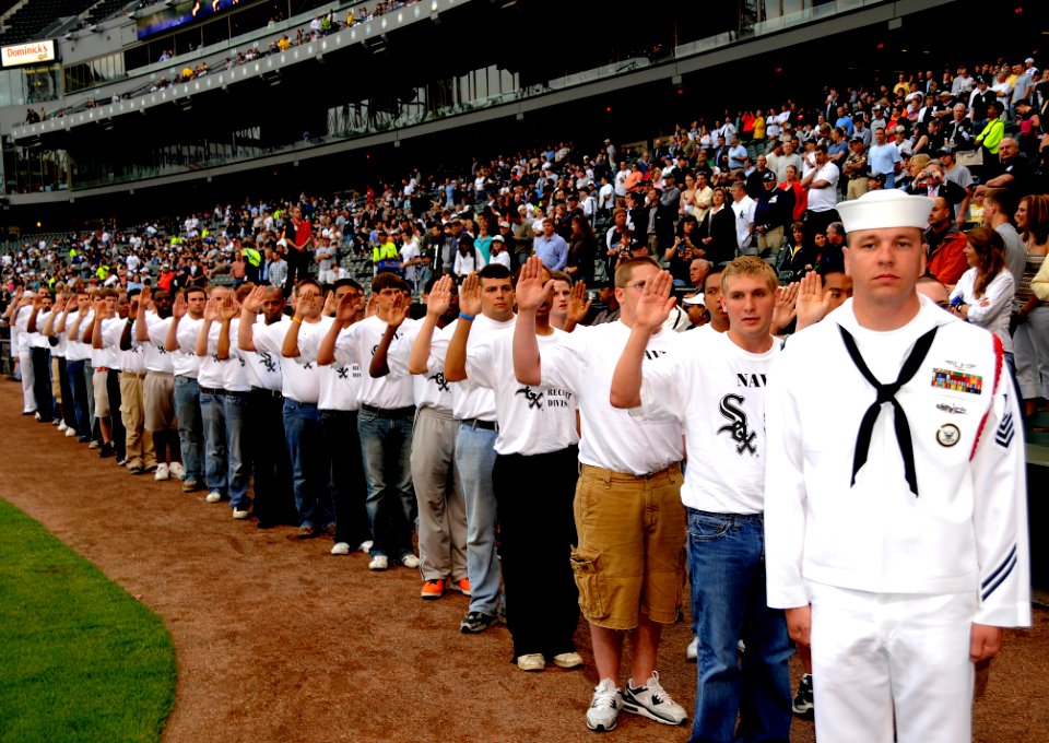 US Navy 080604-N-8848T-701 Recruit Division Commander Aviation Ordnanceman 1st Class Steven Lukasiewicz, of Chicago, stands in front of future recruits he will be in charge of at Recruit Training Command Naval Station Great Lak