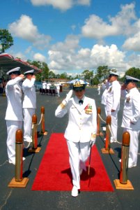 US Navy 080613-N-2468S-001 Cmdr. Stephanie M. Jones, commanding officer of Naval Construction Training Center, Gulfport is saluted as she walks through the sideboys at the conclusion of a change of command ceremony