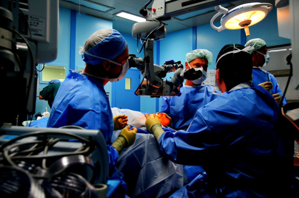 US Navy 080607-N-9689V-014 Cmdr. Kenneth Kubis, director of surgical services for Pacific Partnership 2008, and Air Force Capt. Tighe Richardson, assigned to the Military Sealift Command hospital ship USNS Mercy (T-AH 19), use