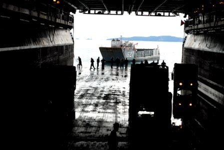 US Navy 080609-N-6936D-196 The forward-deployed amphibious assault ship USS Essex (LHD 2) completes a stern gate marriage with Landing Craft Utility (LCU) 1627