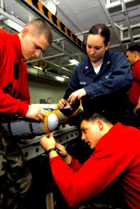 US Navy 080609-N-6538W-214 ailors assemble guided bomb unit (GBU) 38 aboard the Nimitz-class aircraft carrier USS John C. Stennis (CVN 74)