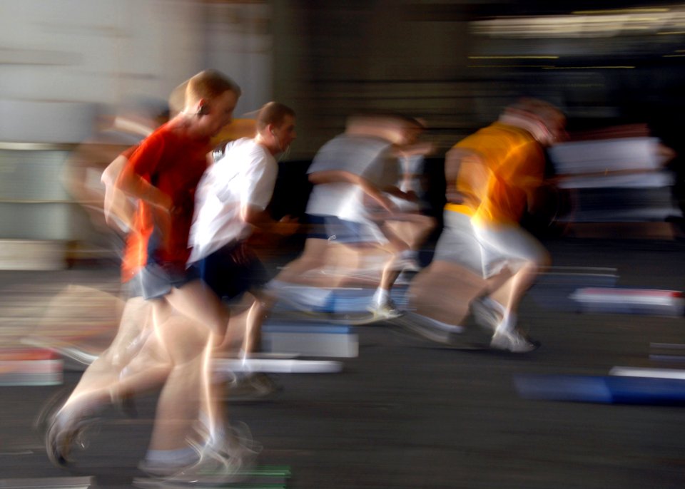 US Navy 080612-N-5617R-093 Sailors conduct physical training in the hangar bay of the Nimitz-class aircraft carrier USS Abraham Lincoln (CVN 72)