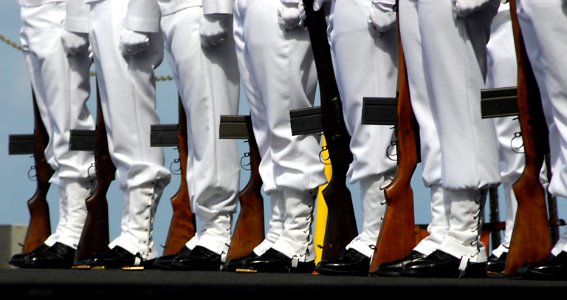 US Navy 080612-N-0640K-212 Sailors assigned to the honor guard aboard the Nimitz-class aircraft carrier USS Ronald Reagan (CVN 76) stand in formation during a burial-at-sea ceremony photo