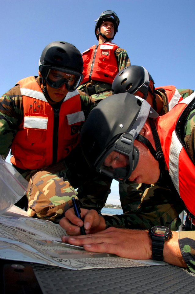 US Navy 080613-N-5366K-221 Special Warfare Combatant-craft Crewman (SWCC) students triangulate their position on an 11-meter rigid hull inflatable boat