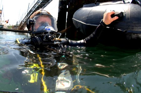 US Navy 080610-N-8298P-052 Members of the U.S. Coast Guard Maritime Safety and Security Team Boston conduct a security dive during a Frontier Sentinel exercise photo