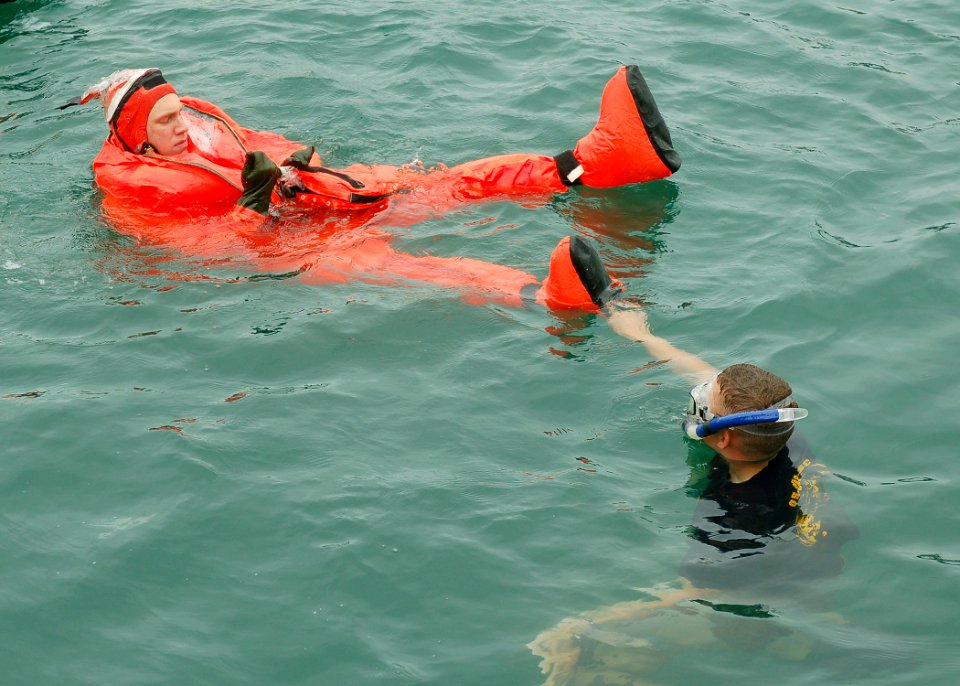 US Navy 080617-N-2218M-003 Twenty crewmembers of the fast-attack submarine USS Charlotte (SSN 766) practice escaping the submarine while wearing submarine escape immersion equipment (SEIE) suits