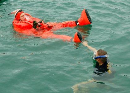 US Navy 080617-N-2218M-003 Twenty crewmembers of the fast-attack submarine USS Charlotte (SSN 766) practice escaping the submarine while wearing submarine escape immersion equipment (SEIE) suits