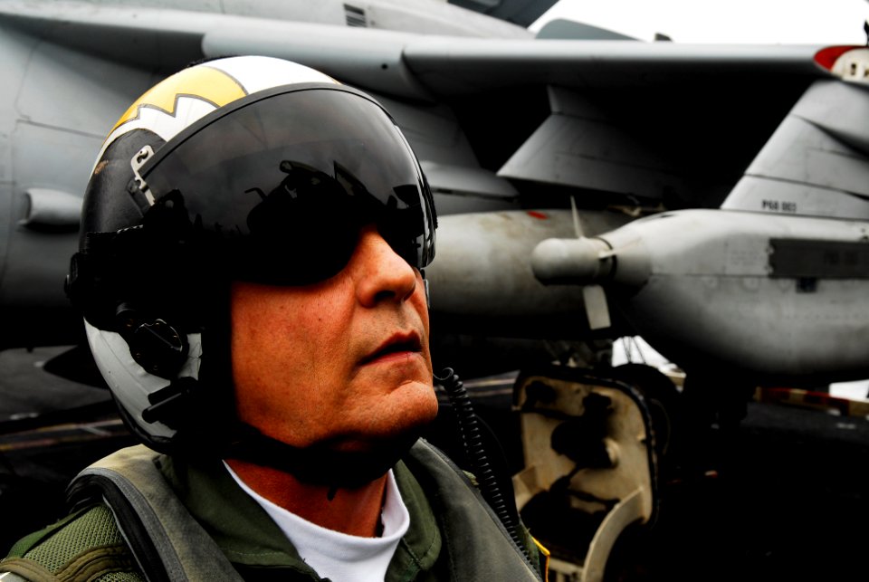 US Navy 080611-N-2610F-080 Rear Adm. Stewart O'Bryan, commander, Carrier Strike Group 3, performs a preflight check on an EA-6B Prowler