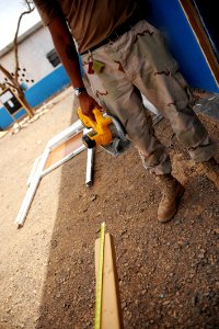 US Navy 080616-N-3674H-077 Builder 3rd Class Drew Whitson, assigned to Naval Mobile Construction Battalion (NMCB) 74, fabricates a door frame photo