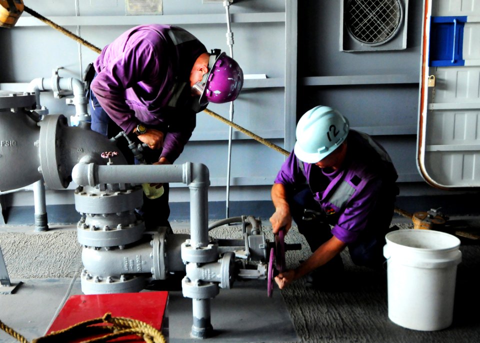US Navy 080614-N-9898L-270 Sailors check fuel being transferred to the Nimitz-class aircraft carrier USS Abraham Lincoln (CVN 72) from the Military Sealift Command fast combat support Ship USNS Rainier (T-AOE 7) during an under