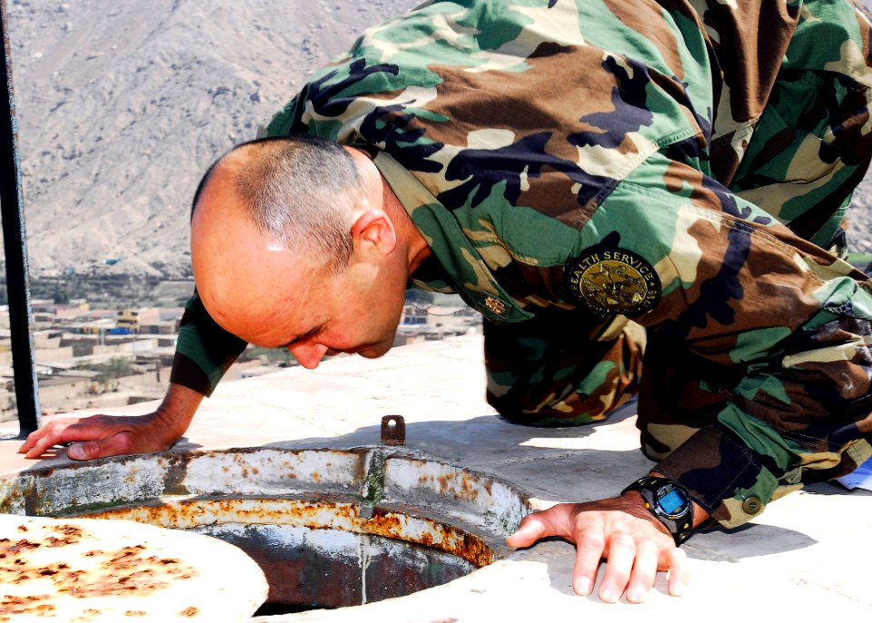 US Navy 080611-N-9150R-046 Lt. Cmdr. Michael Copeland, embarked aboard the amphibious assault ship USS Boxer (LHD 4), inspects a drinking water reservoir in the City of Sayan in the Huacho region of Peru