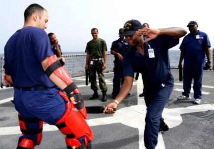 US Navy 080616-G-2443T-010 t. Placido Ndong, a member of the Equatorial Guinea Navy, practices maritime-law enforcement self-defense techniques with Petty Officer 1st Class Marcus Pereira