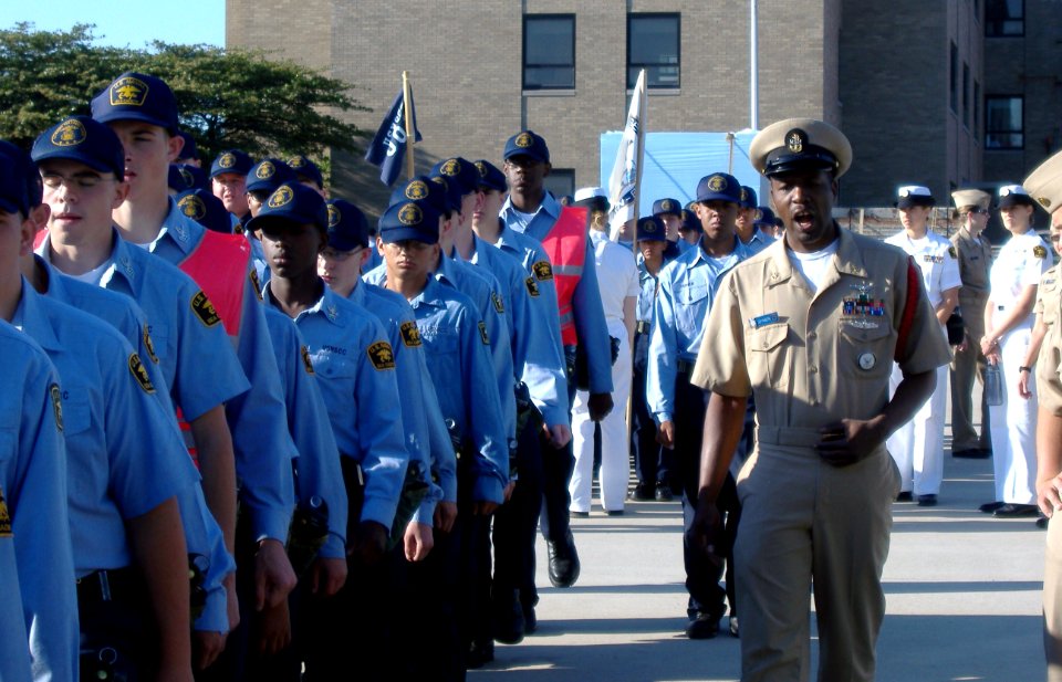 US Navy 080616-O-9999K-013 Chief Aviation Ordnanceman Jay Johnson, a recruit division commander at Recruit Training Center Great Lakes, marches a division of Sea Cadets