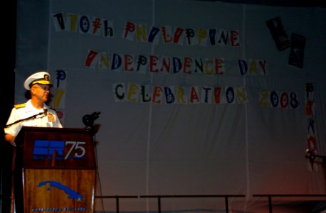US Navy 080614-A-8772R-010 Rear Adm. David M. Thomas Jr., commander, Joint Task Force Guantanamo, delivers a welcome message at the start of the cultural presentation during the 110th Philippine Independence Day celebration