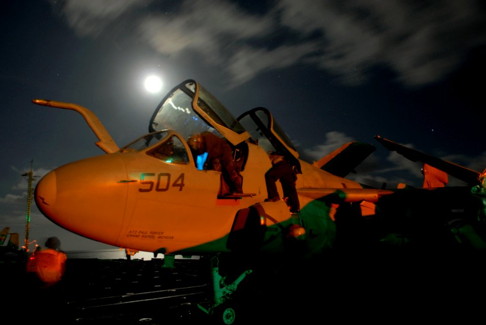 US Navy 080617-N-3946H-179 ailors assigned to Electronic Attack Squadron (VAQ) 136 conduct a post-flight check on the cockpit of an EA-6B Prowler aboard the aircraft carrier USS Kitty Hawk (CV 63)