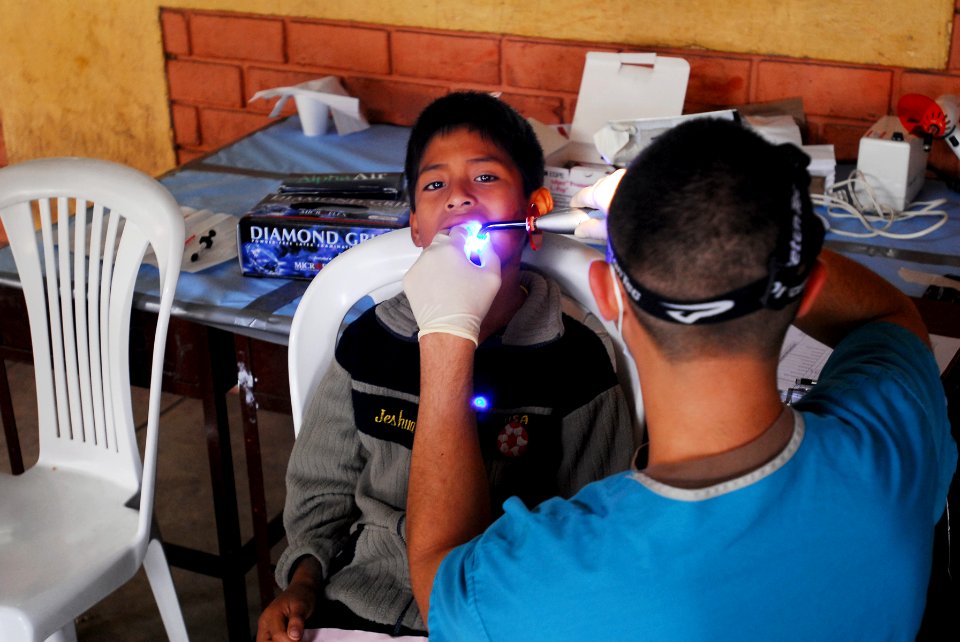 US Navy 080614-N-6410J-061 A patient is treated at the Guillermo Enrique Billinghurst school in Barranca by a medical professional from the amphibious assault ship USS Boxer (LHD 4)
