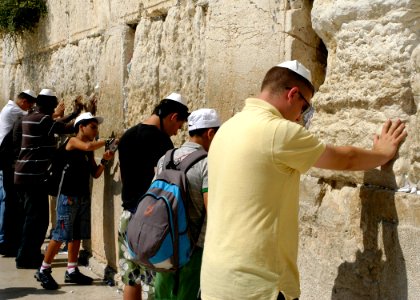 US Navy 080618-N-3316L-232 Yeoman 3rd Class Douglas Pomeroy, assigned to USS Nashville (LPD 13), bows his head and says a prayer at the Western Wall near the end of an MWR-sponsored tour of Jerusalem during a port visit to Haif