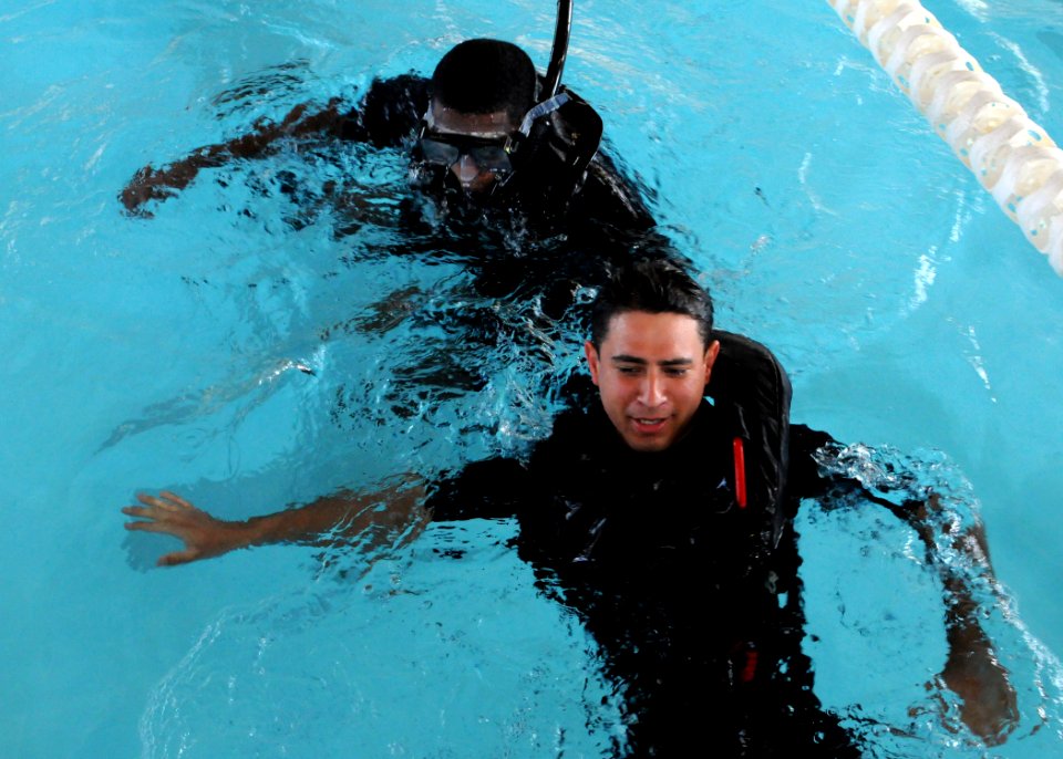 US Navy 080619-N-5642P-017 Machinist Mate 1st Class Anthony Boatner, and Aviation Boatswain Mate Handler Airman Miguel Montecontreras, both Search and Rescue (SAR) swimmers aboard USS Kearsarge (LHD 3), compete in the buddy tow