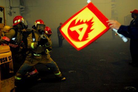 US Navy 080615-N-0684R-047 Sailors fight a simulated fire in the hangar bay aboard the Nimitz-class aircraft carrier USS John C. Stennis (CVN 74) during a general quarters drill