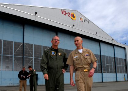 US Navy 080620-N-9860Y-002 Adm. Jonathan Greenert, commander, U.S. Fleet Forces and Capt. Ken Seliga, commodore of Patrol and Reconnaissance Wing 10, depart Hangar 6 en route to a tour of an EP-3E Aries II