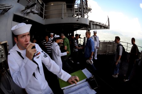 US Navy 080619-N-5961C-003 Interior Communications Specialist 2nd Class Paul Lewis stands Petty Officer of the Watch aboard the Nimitz-class aircraft carrier USS Ronald Reagan (CVN 76) while moored in Hong Kong