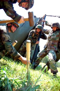 US Navy 080623-N-7367K-001 Seabees assigned to Naval Mobile Construction Battalion (NMCB) 7 work together to erect a field tent at during a field exercise (FEX) at Camp Shelby