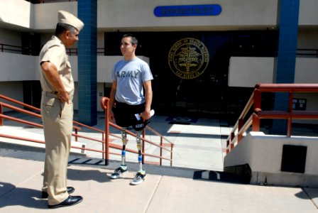 US Navy 080617-N-9818V-239 Master Chief Petty Officer of the Navy (MCPON) Joe R. Campa Jr. speaks to U.S. Army Spec. Joseph Serino after meeting with chief petty officers during a chief petty officer call at Naval Medical Cente