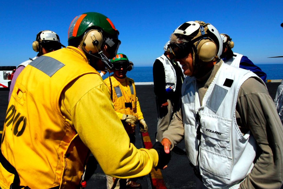 US Navy 080621-N-0684R-008 Aircraft launching officer Lt. Edwin Bounds shakes hands with University of Southern California (USC) head football Coach, Pete Carroll on the flight deck aboard the Nimitz-class aircraft carrier USS