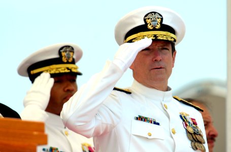 US Navy 080621-N-8467N-009 Vice Admr. John J. Donnelly, commander, Naval Submarine Forces, salutes during the playing of the National Anthem at the christening ceremony for the Pre-Commissioning Unit (PCU) New Hampshire (SSN 77