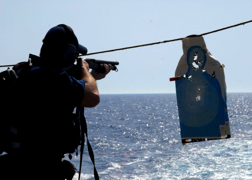 US Navy 080619-N-2838W-126 Gunner's Mate 2nd Class James Hults, a member of the visit, board, search and seizure (VBSS) team aboard the guided-missile destroyer USS Bulkeley (DDG 84), practices essential gun-firing procedures w