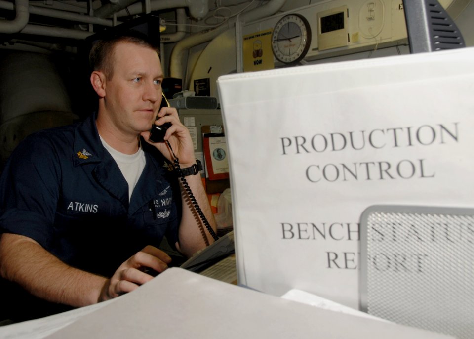 US Navy 080619-N-1281H-096 Aviation Support Equipment Technician 1st Class Jamey Atkins screens induction maintenance action forms on a computer aboard the Nimitz-class aircraft carrier USS Abraham Lincoln (CVN 72)