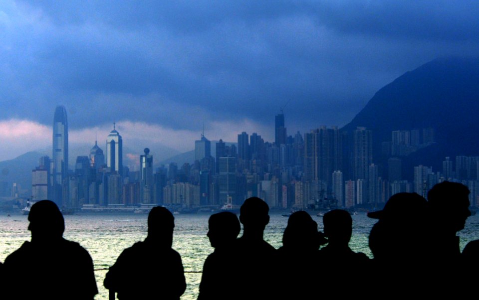 US Navy 080619-N-5961C-001 Sailors gather in a hangar bay aboard the aircraft carrier USS Ronald Reagan (CVN 76) as the ship approaches Hong Kong for a port visit