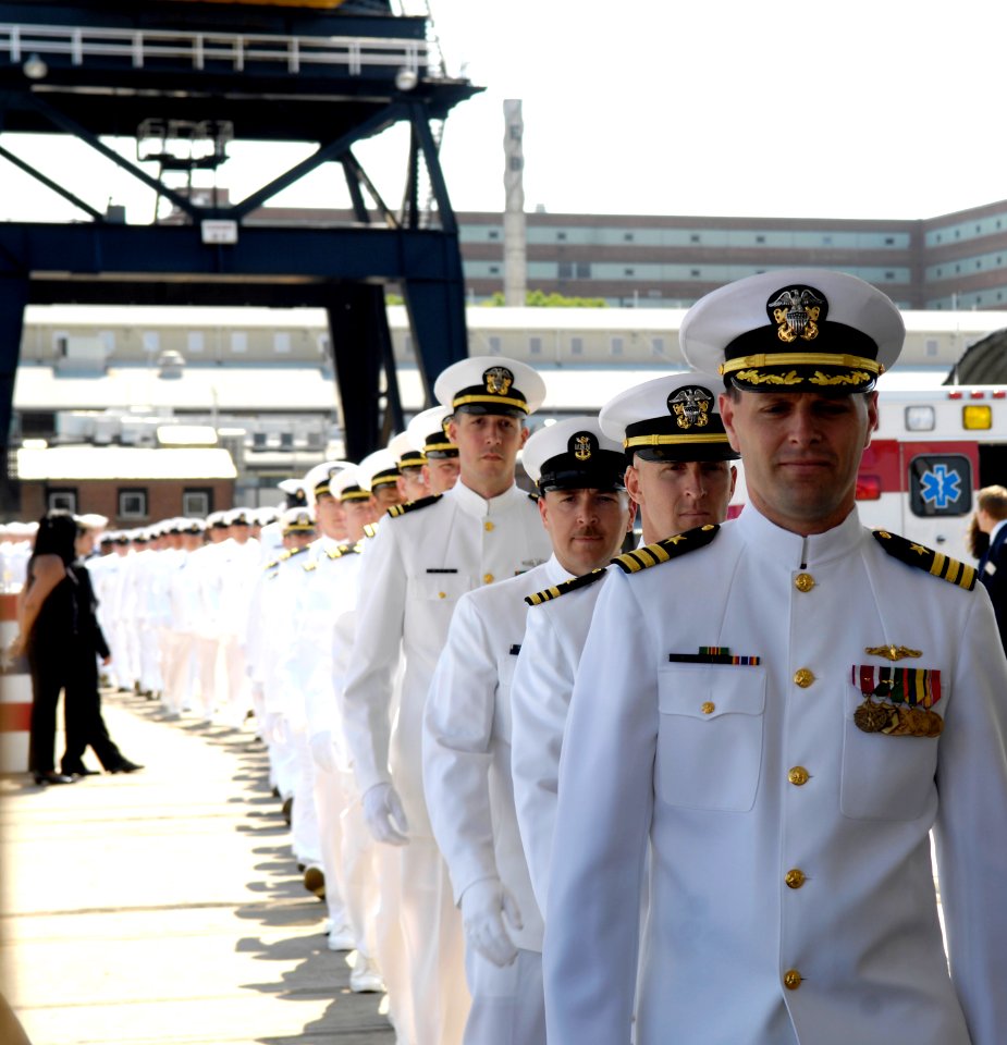 US Navy 080621-N-8467N-004 Cmdr. Michael J. Stevens, commanding officer of the Pre-Commissioning Unit (PCU) New Hampshire (SSN 778), leads his crew to the ship before its christening at General Dynamics Electric Boat in Groton