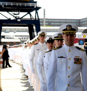 US Navy 080621-N-8467N-004 Cmdr. Michael J. Stevens, commanding officer of the Pre-Commissioning Unit (PCU) New Hampshire (SSN 778), leads his crew to the ship before its christening at General Dynamics Electric Boat in Groton